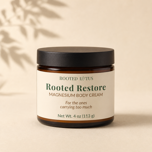 Rooted Restore magnesium body cream in an amber glass jar by Rooted Lotus